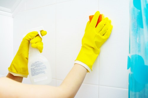 Local cleaners working in a Waterloo apartment kitchen and living space